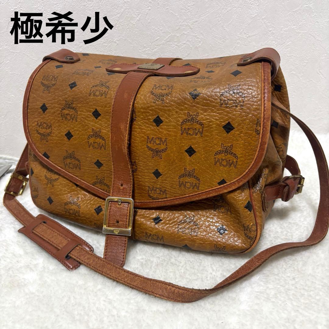 【極希少】MCM ソミュール　コニャック　ショルダーバッグ　ヴィセトス柄 MCM◇ショルダーバッグ/PVC/BRW/ヴィセトス柄/筒型ショルダー